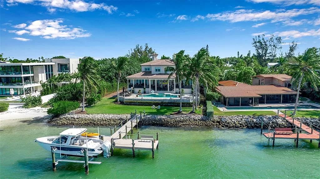 Step into the epitome of island living at 3500 Bayou Louise Lane, where luxury meets paradise on Siesta Key's north end. This exquisite waterfront residence boasts unparalleled sunset views and a design by Architect Thorning Little, offering an open-concept living area, high-end appliances, and floor-to-ceiling windows framing the 180-degree Gulf of Mexico vista.