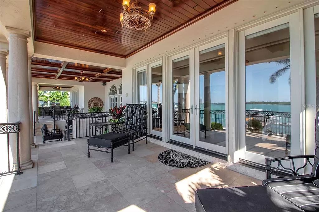 Step into the epitome of island living at 3500 Bayou Louise Lane, where luxury meets paradise on Siesta Key's north end. This exquisite waterfront residence boasts unparalleled sunset views and a design by Architect Thorning Little, offering an open-concept living area, high-end appliances, and floor-to-ceiling windows framing the 180-degree Gulf of Mexico vista.