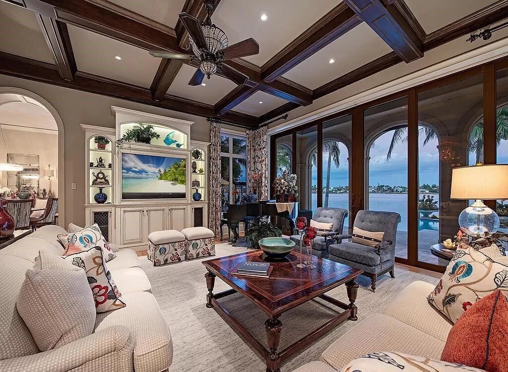 Discover an unparalleled living experience at 960 17th Ave S, Naples, Florida, where luxury meets breathtaking natural beauty. This extraordinary estate spans approximately 1.12 acres, offering 340 feet of waterfrontage with unobstructed bay views.