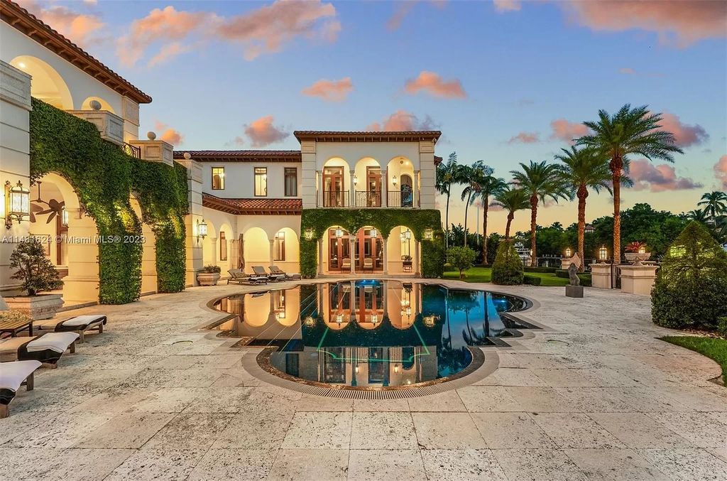 Indulge in the pinnacle of waterfront luxury at 150 Edgewater Drive, Coral Gables. This Mediterranean-style estate, nestled on prestigious Edgewater Drive, boasts 180 feet of deep-water frontage, an 80-foot inlet slip, and direct bay access - a paradise for boating enthusiasts.
