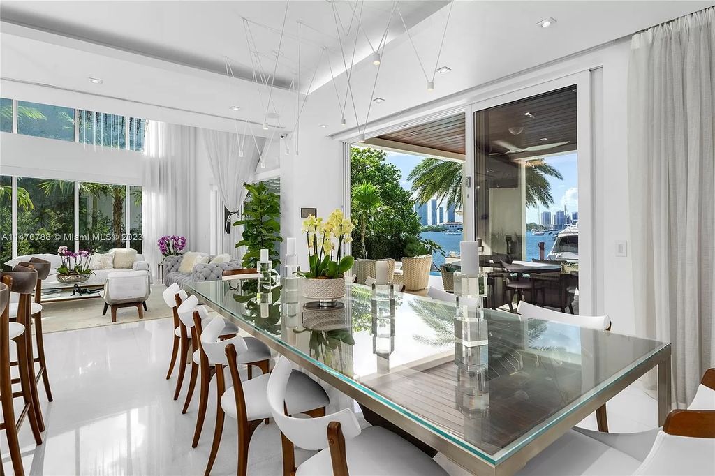 Perched on the tip of Hibiscus Island, 441 N Hibiscus Dr, Miami Beach, FL, is a contemporary masterpiece boasting 5 bedrooms and 7 bathrooms across 4,827 square feet. Offering unobstructed Miami skyline and bay views, this tri-level waterfront home features soaring ceilings, floor-to-ceiling windows, and a chef's kitchen with high-end appliances.