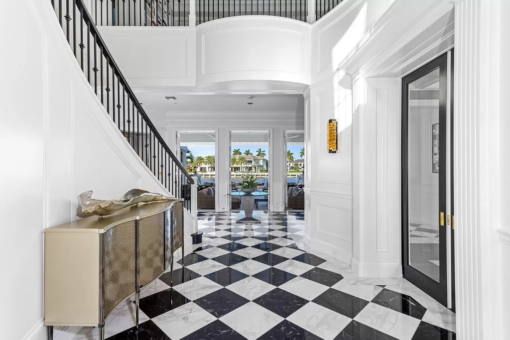 Discover the epitome of luxury living at 2989 Spanish River Rd in Boca Raton's esteemed Estate Section. Beyond the gated cobblestone drive lies an exquisite Intracoastal Compound enveloped by meticulously landscaped grounds adorned with medjool date palms and immaculate topiary.