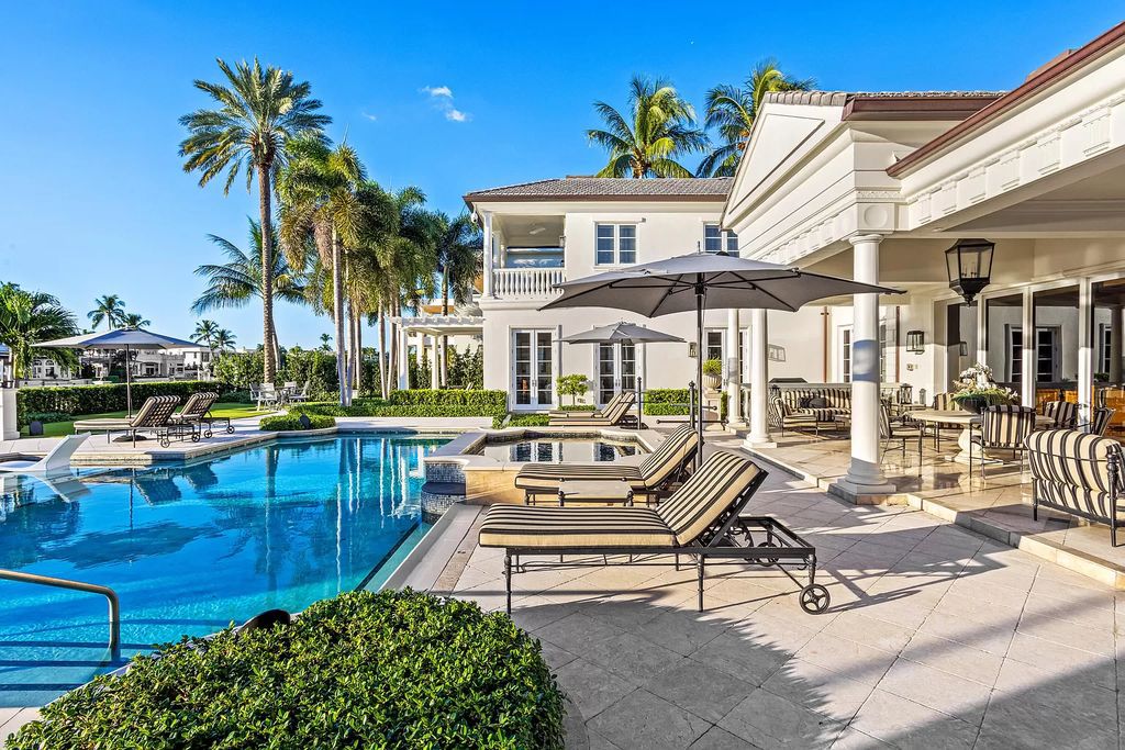 Discover the epitome of luxury living at 2989 Spanish River Rd in Boca Raton's esteemed Estate Section. Beyond the gated cobblestone drive lies an exquisite Intracoastal Compound enveloped by meticulously landscaped grounds adorned with medjool date palms and immaculate topiary.