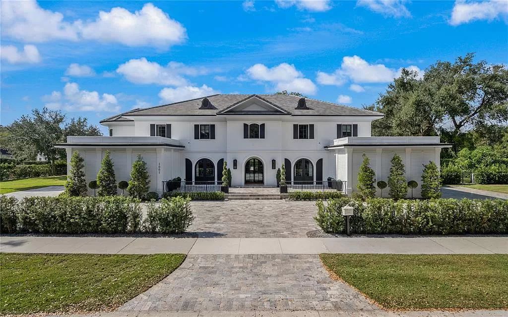Discover Winter Park's epitome of luxury living in this architectural masterpiece by award-winning architect Larry Boerder. Just steps from Park Avenue's upscale boutiques and restaurants, this 2021-built estate boasts opulence at every turn.