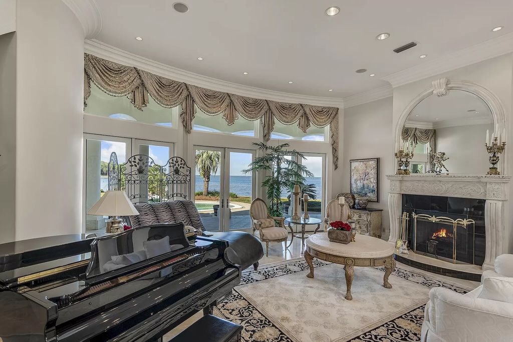 Discover the pinnacle of luxury living in this exclusive Destin estate within the prestigious Kelly Plantation subdivision. Situated on a rare 1.5-acre double lot peninsula, this Mediterranean-inspired masterpiece boasts panoramic bay views and a secure harbor for multiple large yachts.