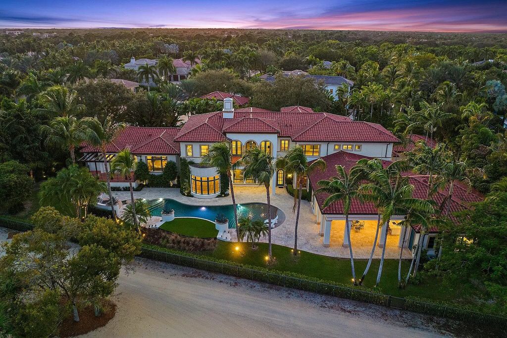 Discover the epitome of luxury at 11759 Elina Ct, a meticulously renovated estate in the heart of Old Palm, Palm Beach Gardens. Boasting unparalleled views of the ninth fairway and the newly renovated clubhouse, this 8-bed, 9-bath residence offers a perfect blend of privacy and elegance behind a private gate on a .84-acre lot.
