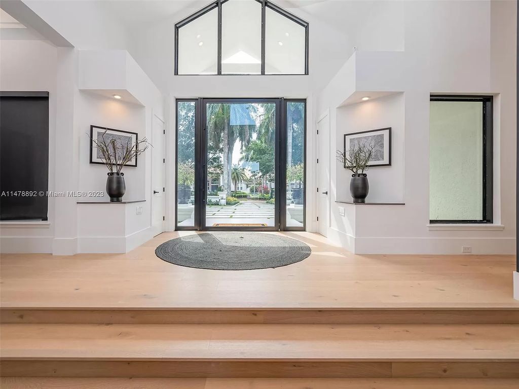 Experience the height of luxury living at 3497 Derby Ln, Weston, FL in the sought-after Windmill Ranch Estates. This fully renovated, smart home exudes modern opulence, boasting a new roof, custom impact windows, and doors