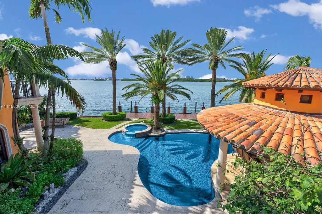 Experience the epitome of Mediterranean luxury at 230 Bal Bay Dr, an exclusive waterfront estate in Bal Harbour Village. Crafted by the esteemed Alexander Group, this custom-built masterpiece boasts exquisite details like custom millwork, Jerusalem stone flooring, and marble accents throughout.