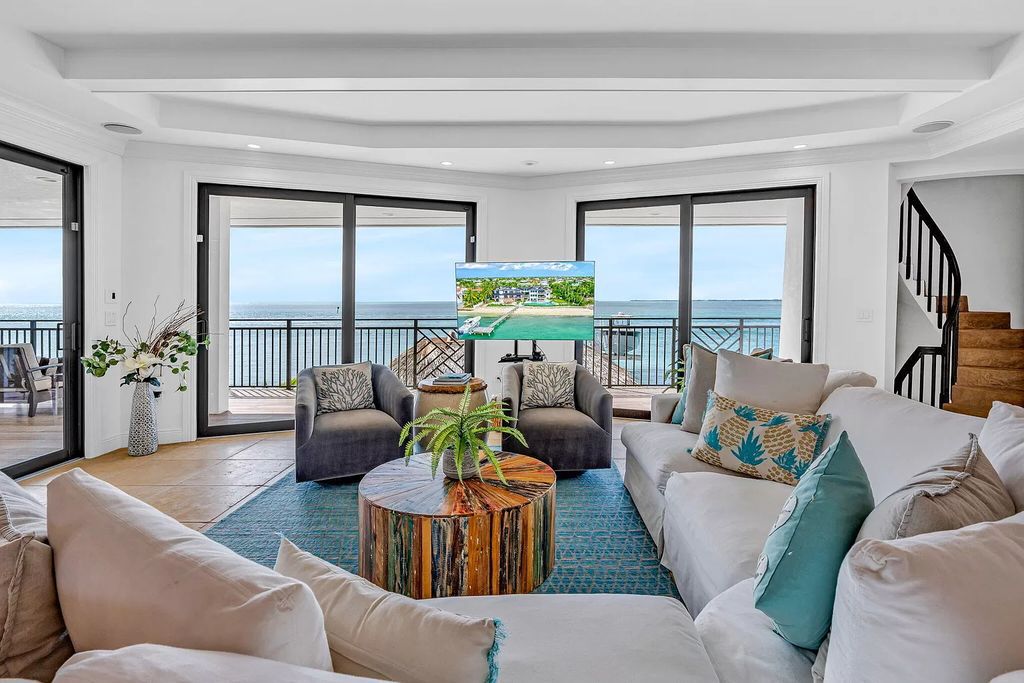 Experience the epitome of luxurious coastal living at the iconic Lighthouse on Key Colony Beach's prestigious 15th Circle. This recently updated home offers a seamless blend of comfort and elegance, boasting breathtaking ocean views from its generously sized living spaces.