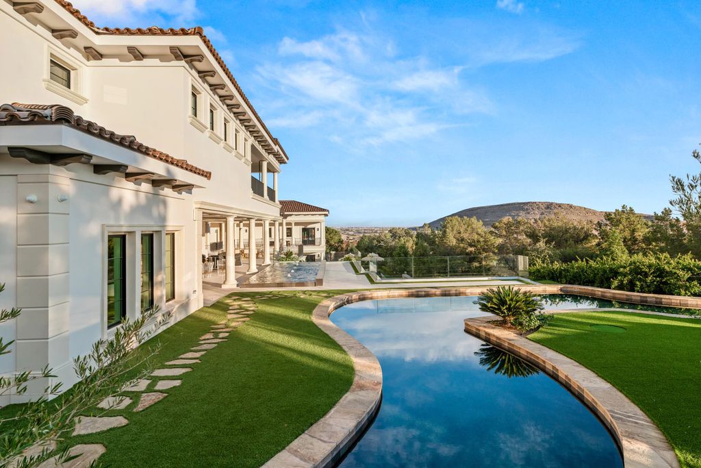 48 Augusta Canyon Way Home in Las Vegas, Nevada. Unveil the epitome of opulence at "Villa Diamonte," located at 48 Augusta Canyon Way, a spectacular estate sprawled across 1.36 acres in Southern Highlands. Meticulously crafted in 2020, this stunning masterpiece features eight bedrooms, thirteen bathrooms, and a spacious six-car garage. Designed for ultimate entertainment, the lower level boasts a bar area, lounge, wine room, karaoke room, theater, and a resort-style pool.