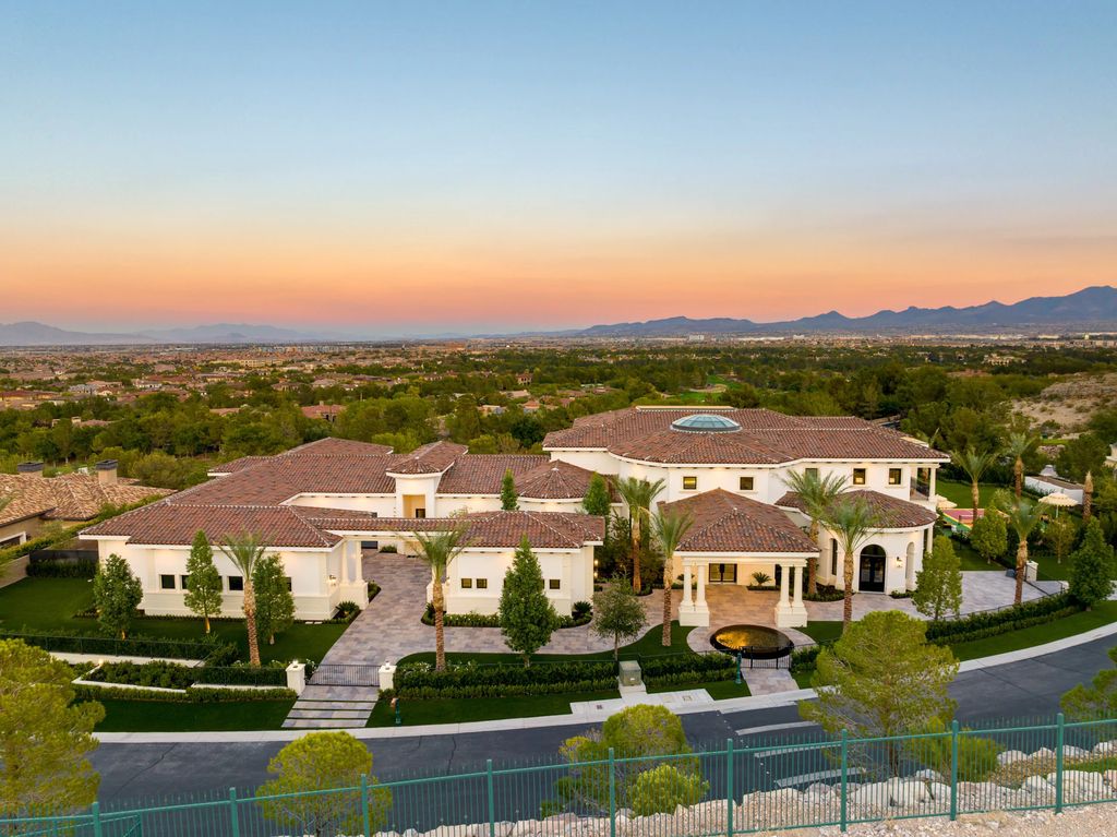 48 Augusta Canyon Way Home in Las Vegas, Nevada. Unveil the epitome of opulence at "Villa Diamonte," located at 48 Augusta Canyon Way, a spectacular estate sprawled across 1.36 acres in Southern Highlands. Meticulously crafted in 2020, this stunning masterpiece features eight bedrooms, thirteen bathrooms, and a spacious six-car garage. Designed for ultimate entertainment, the lower level boasts a bar area, lounge, wine room, karaoke room, theater, and a resort-style pool.