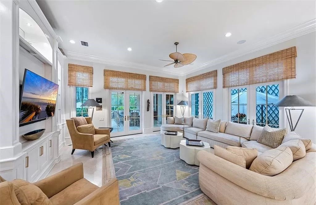 Elegance and modernity converge in this meticulously updated estate boasting 2021 enhancements, including a new roof, impact doors and windows, a chef’s kitchen, fireplaces, lighting, guest baths, a full house generator, and Sonos sound.