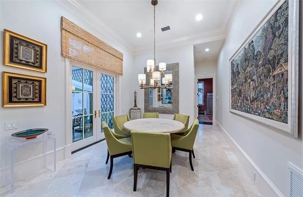 Elegance and modernity converge in this meticulously updated estate boasting 2021 enhancements, including a new roof, impact doors and windows, a chef’s kitchen, fireplaces, lighting, guest baths, a full house generator, and Sonos sound.