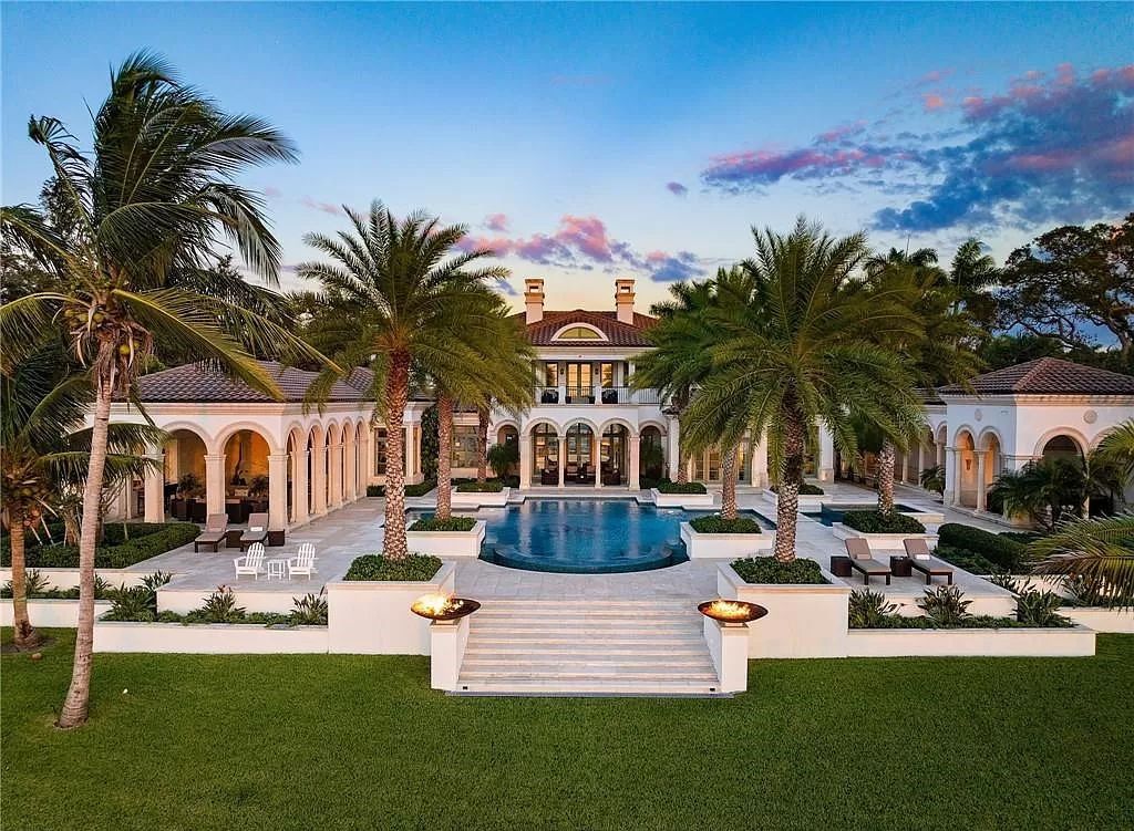 Indulge in the pinnacle of luxury at this Palladian-inspired Grand Estate in Fort Myers. Sprawling across 2 waterfront acres, this 19,184 square feet masterpiece boasts 4 bedrooms, 2 dens, a private cinema, and a 2,000-bottle wine cellar in the main residence, with an additional 3 bedrooms in the guest house.