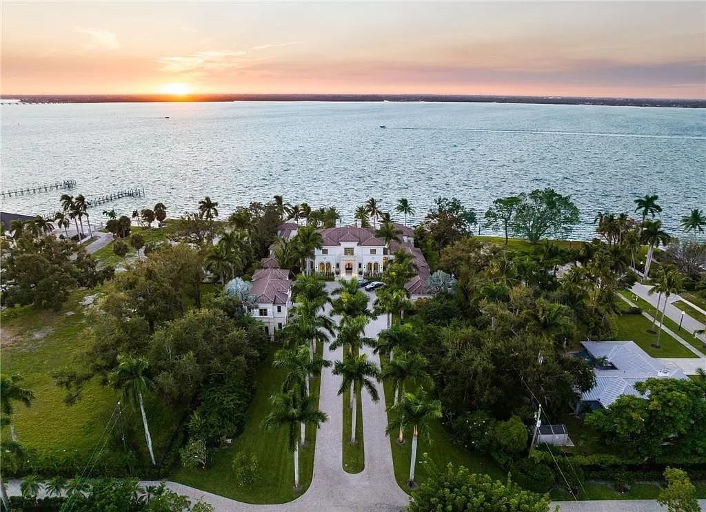 Indulge in the pinnacle of luxury at this Palladian-inspired Grand Estate in Fort Myers. Sprawling across 2 waterfront acres, this 19,184 square feet masterpiece boasts 4 bedrooms, 2 dens, a private cinema, and a 2,000-bottle wine cellar in the main residence, with an additional 3 bedrooms in the guest house.