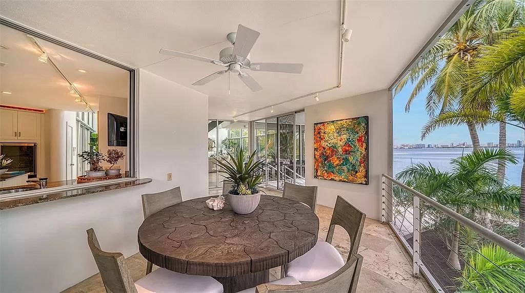 This award-winning Carl Abbott residence in Sarasota epitomizes luxury living with breathtaking bay and city skyline views. Designed to maximize natural light, the home exudes elegance and seamless integration with its surroundings.