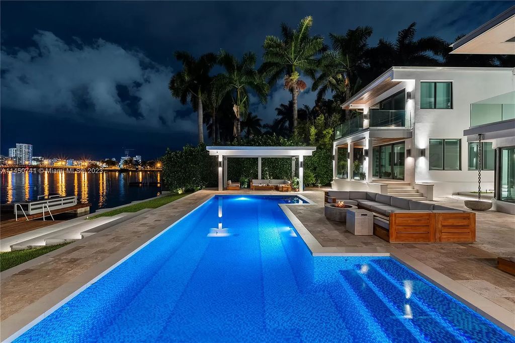 Nestled on E Rivo Alto Dr. in Miami Beach's Venetian Islands, this waterfront haven is a masterpiece. Boasting 90 feet of waterfront, the home offers an artfully designed space filled with natural light, perfect for collectors.