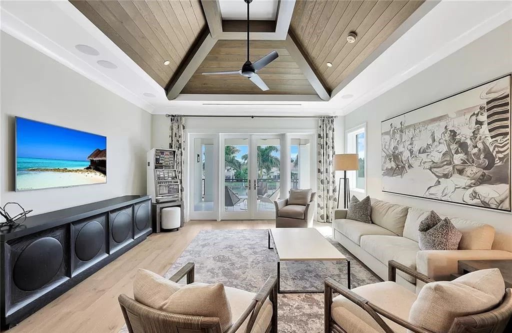 Discover an unparalleled oasis in Naples, Florida's esteemed Port Royal Community at 850 Nelsons Walk. This meticulously crafted estate seamlessly intertwines indoor and outdoor spaces, offering an entertainer's dream with an infinity-edge pool, outdoor kitchen, wine cellar, and more.