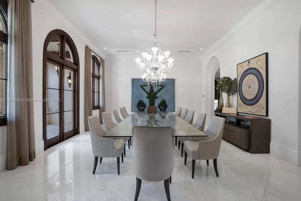 Discover an unrivaled luxury compound on Palm Island, Miami Beach, spanning 2 acres with 300 feet of waterfront. This extraordinary estate comprises three exquisite homes showcasing impeccable craftsmanship and the finest materials.