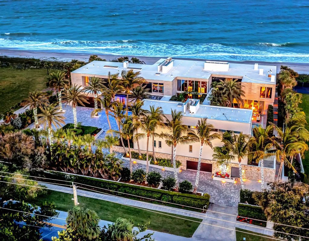 In the heart of Vero Beach's lively seaside downtown lies an exclusive oceanfront compound boasting 8 beds, 12 baths, and parking for 10 cars within its reinforced concrete and steel structure anchored by 255 pilings.