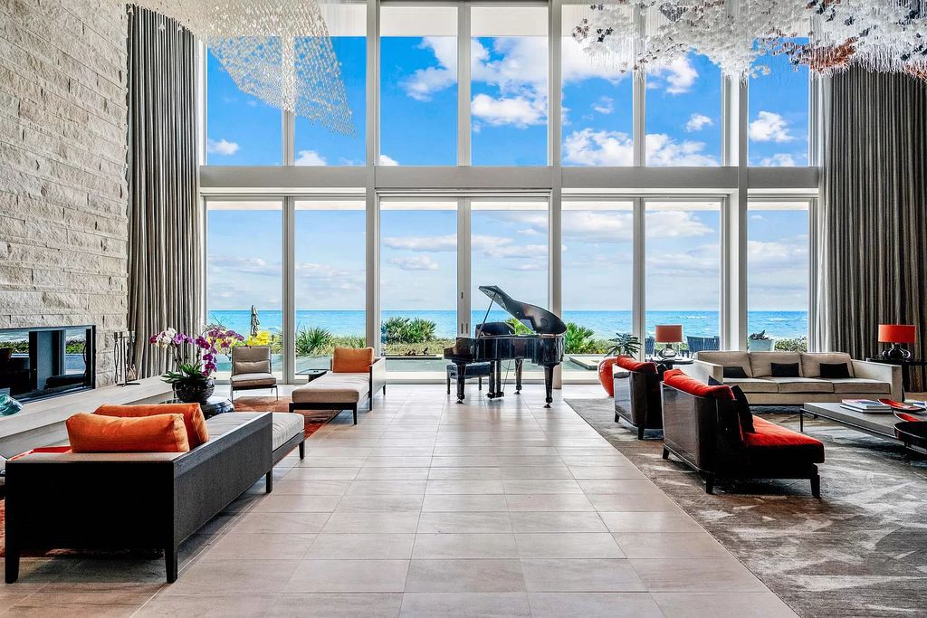 In the heart of Vero Beach's lively seaside downtown lies an exclusive oceanfront compound boasting 8 beds, 12 baths, and parking for 10 cars within its reinforced concrete and steel structure anchored by 255 pilings.