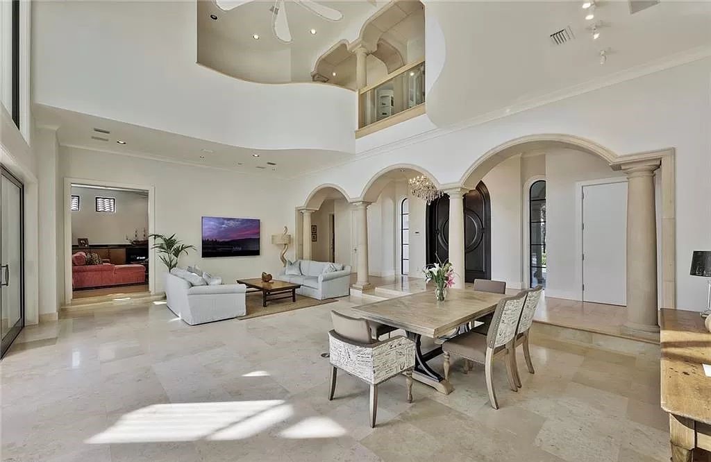 Embrace the pinnacle of coastal luxury at 1450 Gulfstar Dr S, Naples, Florida. Nestled within the exclusive Southpointe Island enclave, this architectural marvel boasts direct Gulf access and recent updates that elevate it to unparalleled sophistication.