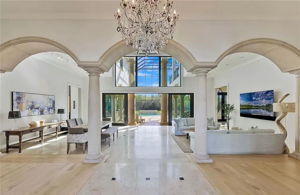 Embrace the pinnacle of coastal luxury at 1450 Gulfstar Dr S, Naples, Florida. Nestled within the exclusive Southpointe Island enclave, this architectural marvel boasts direct Gulf access and recent updates that elevate it to unparalleled sophistication.