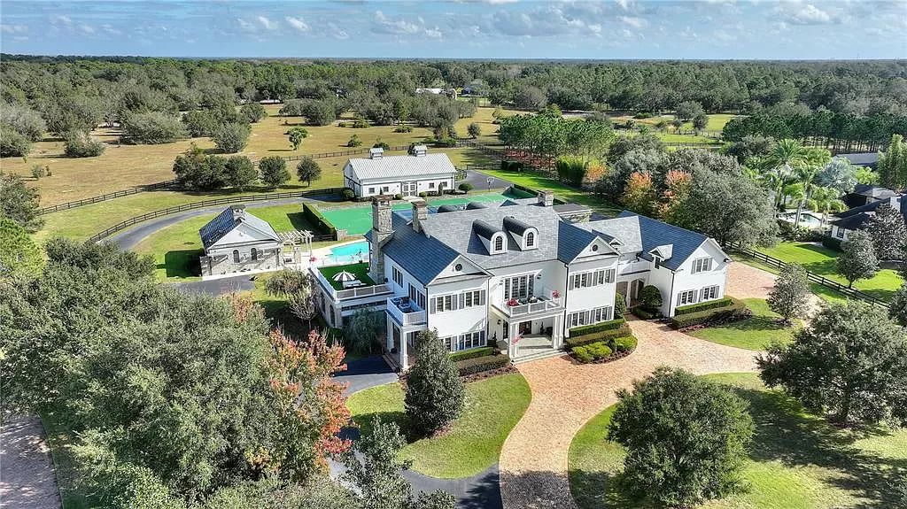 Discover an unparalleled estate in the exclusive Mills Cove enclave, just minutes from Orlando's bustle yet nestled on 13 acres that feel like a serene country retreat.