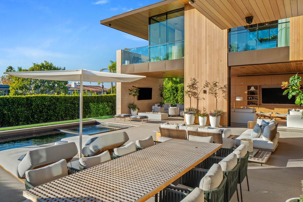 1001 1st Street Home in Manhattan Beach, California. Explore the epitome of luxurious beach living with this meticulously crafted 6-bed, 9-bath Contemporary estate in Manhattan Beach. From the undulating wave-like concrete walls to the warm cedar interiors, every detail exudes sophistication. 