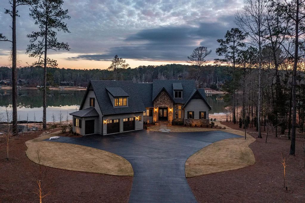 1583 Bulgers Mill Way Home in Alexander City, Alabama. Explore the epitome of lake living in this custom-built 5BR/5.5BA home located within The Willows of Willow Point on Lake Martin. Designed by renowned architect Mitch Ginn, this 2020 gem offers sun-soaked southern views, a 32' boat slip, and high-end furnishings by Mathison Interiors. 