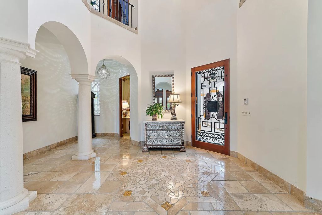 Discover the epitome of refined living at 2929 Marys Way, a Moroccan-inspired waterfront sanctuary in Palm Beach Gardens, Florida. This 5-bed, 9-bath home, remodeled in 2018, boasts 7,175 square feet of meticulously crafted living space on a sprawling 0.68-acre lot.