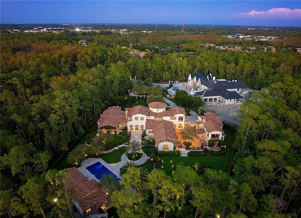 Crafted by London Bay Homes, this 5-bedroom, 8-bathroom masterpiece spans 11,408 square feet on a 1.78-acre lot within the prestigious Mediterra community.