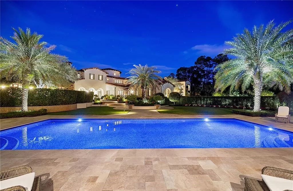 Crafted by London Bay Homes, this 5-bedroom, 8-bathroom masterpiece spans 11,408 square feet on a 1.78-acre lot within the prestigious Mediterra community.