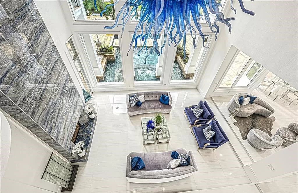 Welcome to Sunspray Estate, an exquisite 5-bedroom masterpiece nestled along the shores of a secluded spring-fed lake in Naples, Florida.