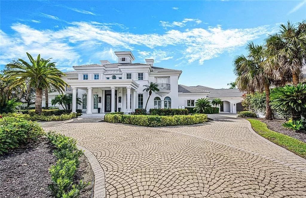 Welcome to Sunspray Estate, an exquisite 5-bedroom masterpiece nestled along the shores of a secluded spring-fed lake in Naples, Florida.