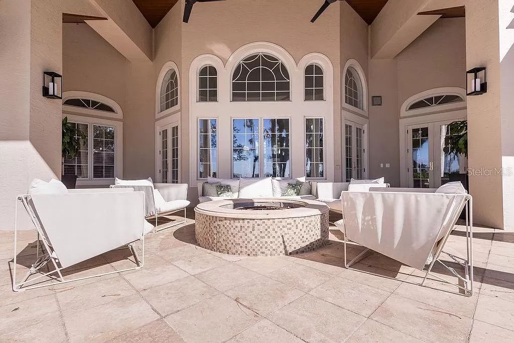 Nestled in the prestigious guard-gated Cypress Point community, this exceptional 6-bedroom, 9-bathroom estate at 9220 Point Cypress Dr, Orlando, Florida 32836 offers a rare glimpse of luxurious living.