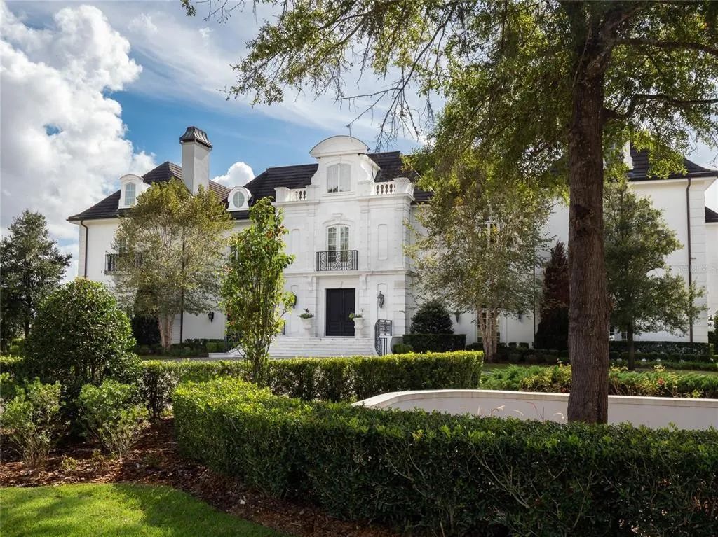 This exceptional estate, nestled within Golden Ocala, a prestigious country club neighboring the World Equestrian Center, defines luxury living at its pinnacle.