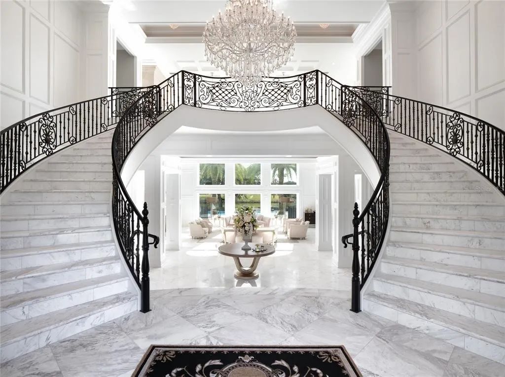 This exceptional estate, nestled within Golden Ocala, a prestigious country club neighboring the World Equestrian Center, defines luxury living at its pinnacle.