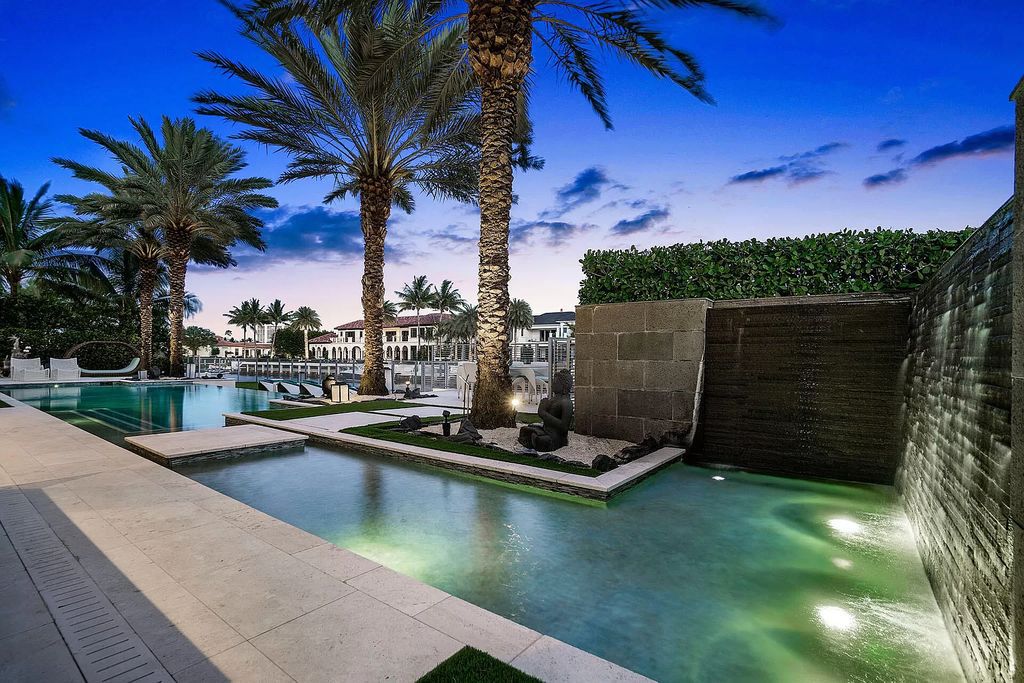 Discover an unparalleled waterfront oasis at 290 South Maya Palm Drive, a breathtaking 5-bedroom, 6.2-bathroom estate by Bloomfield Construction.