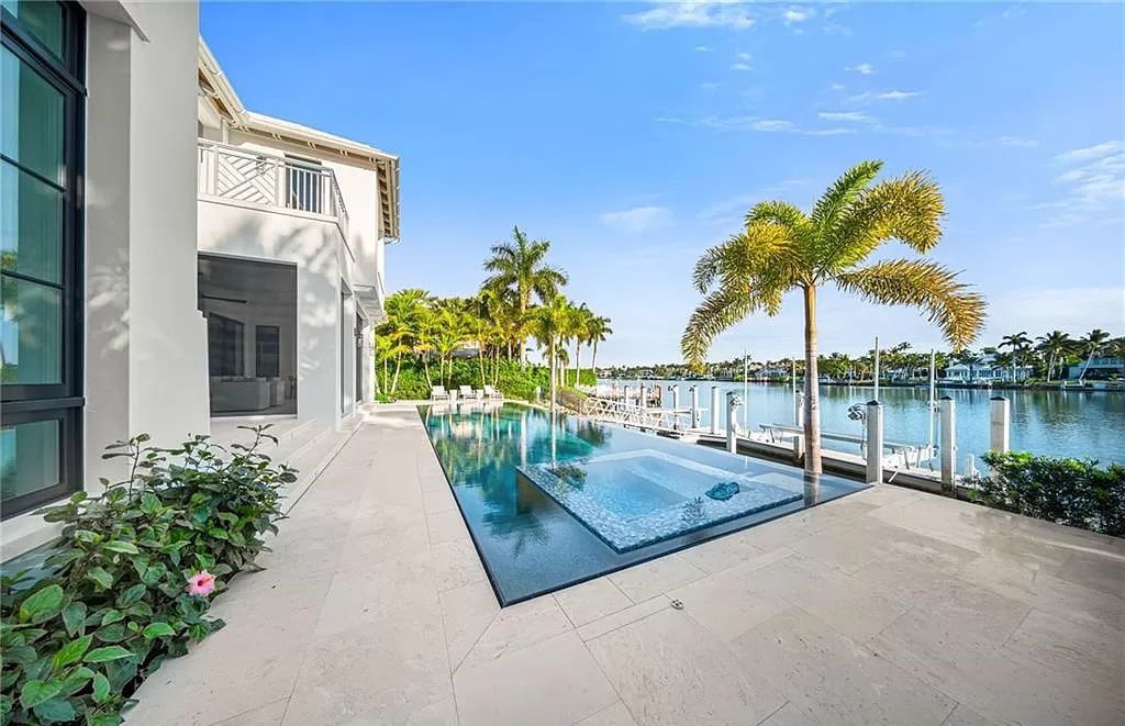 This Port Royal gem on Treasure Cove's western shore boasts unmatched panoramic water views. Crafted by D.Garrett Construction and Stofft Cooney Architects, it seamlessly blends indoor and outdoor living, featuring an infinity-edge pool mirroring the nearby beach.