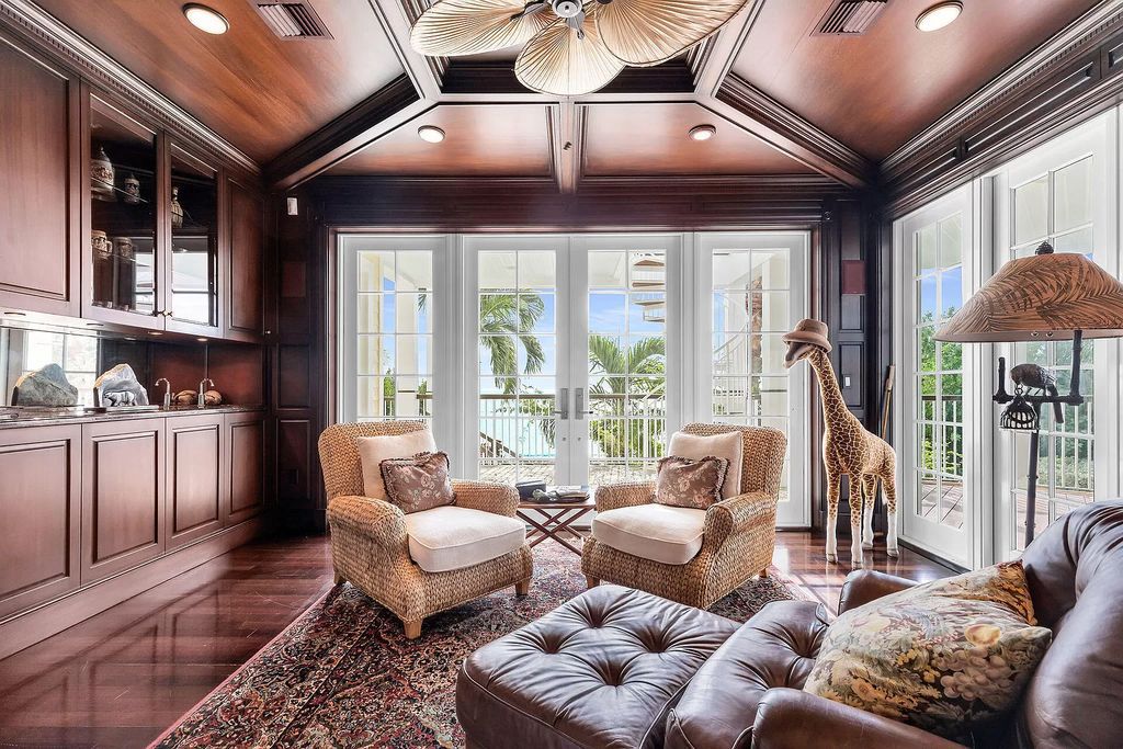Experience the epitome of luxury island living at this exquisite Luxury Oceanfront Estate in Islamorada. Nestled on 10.85 acres along the Atlantic Ocean, this 2006-built property offers 450 feet of pristine beachfront accessed through a private, gated entrance.