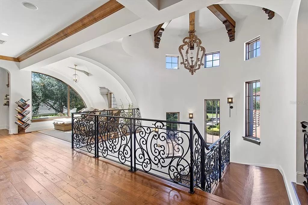 Built by Goehring & Morgan in 2009, this 8,037 square feet home on a 4-acre lot exudes elegance with detailed ceilings, opulent decor, and thoughtful design.