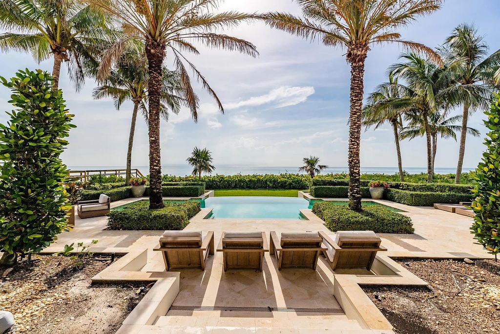 Nestled along the picturesque shores of Vero Beach, this beachfront masterpiece embodies coastal luxury. With breathtaking ocean panoramas, a two-level office/library, chef's kitchen, and a dreamy master suite, this home exudes sophistication.