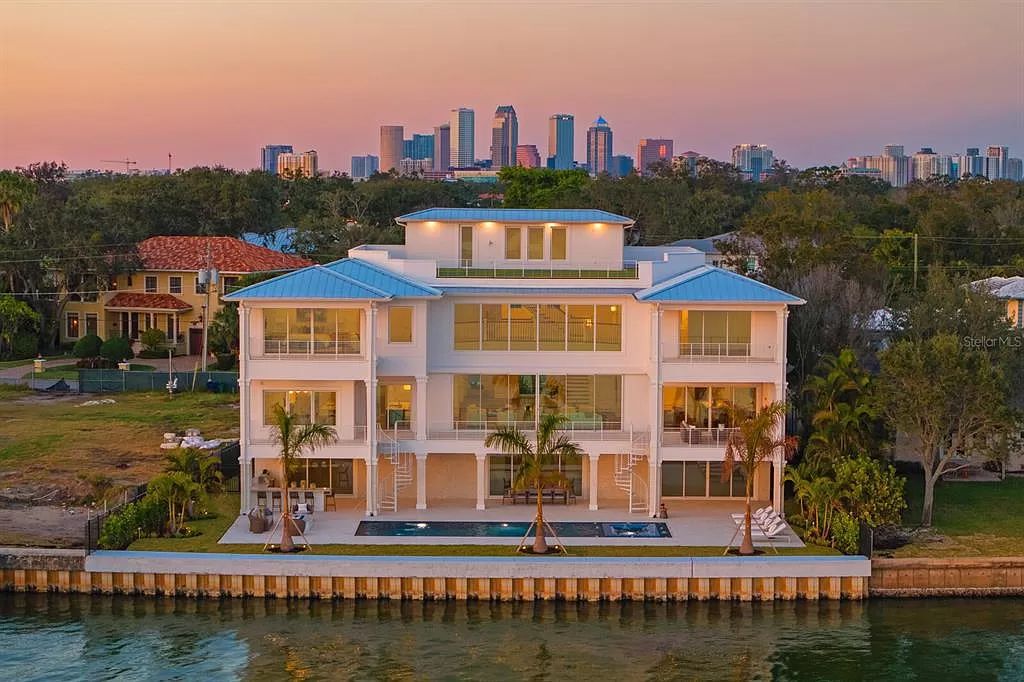 Embrace the epitome of luxury living in this newly constructed Ultra-Luxury Modern Coastal estate at 96 Martinique Ave, Tampa, FL 33606.