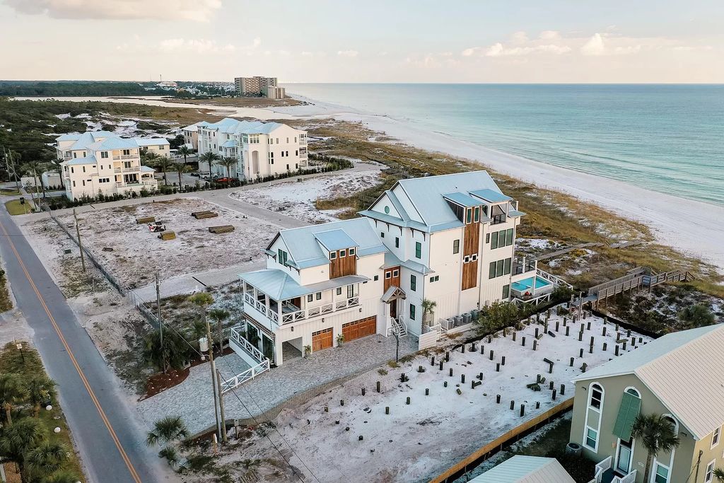Built in 2020, this Gulf-front property offers breathtaking views from all four levels, showcasing the white sands and emerald waters.