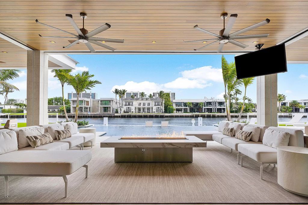 This waterfront haven boasts 6 beds, 9 baths (7 full, 2 half), and a spacious 8,921 square feet living space. Positioned on a premier Intracoastal lot, the property provides stunning water views, a private dock, and 104' of waterfrontage.