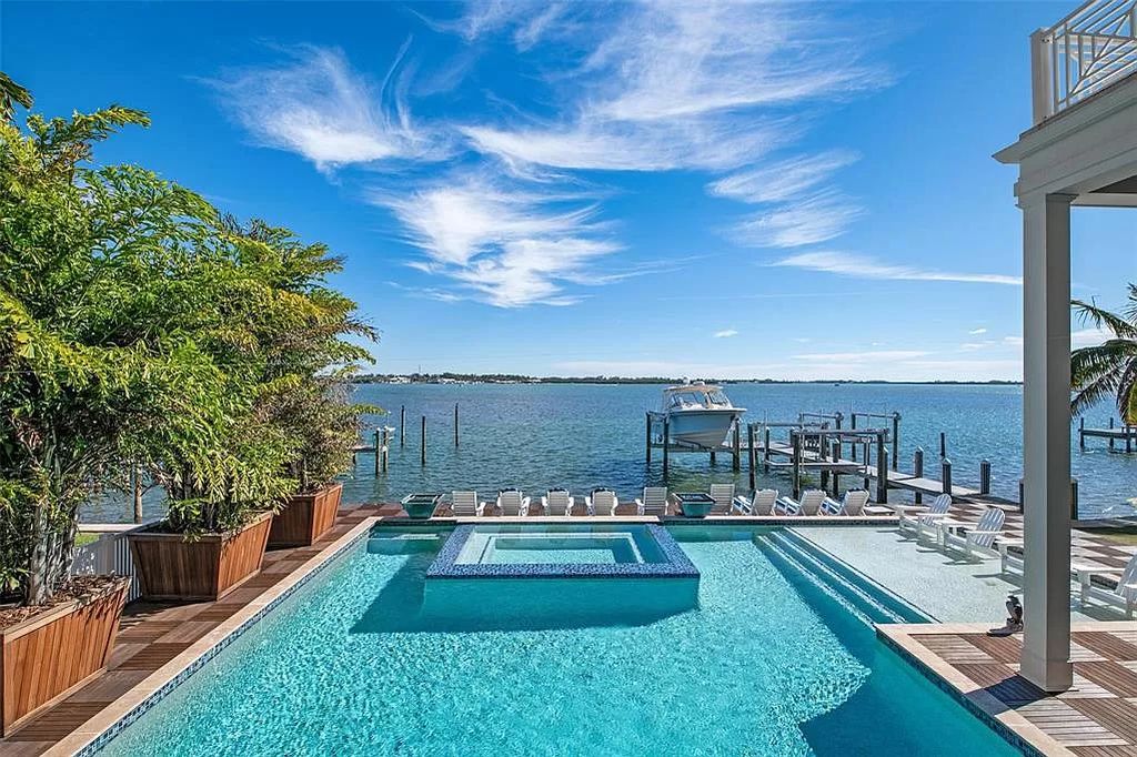 Discover luxury island living at its best in this exquisite seven-bedroom bayfront home in Mandalay Bay, Anna Maria Island.