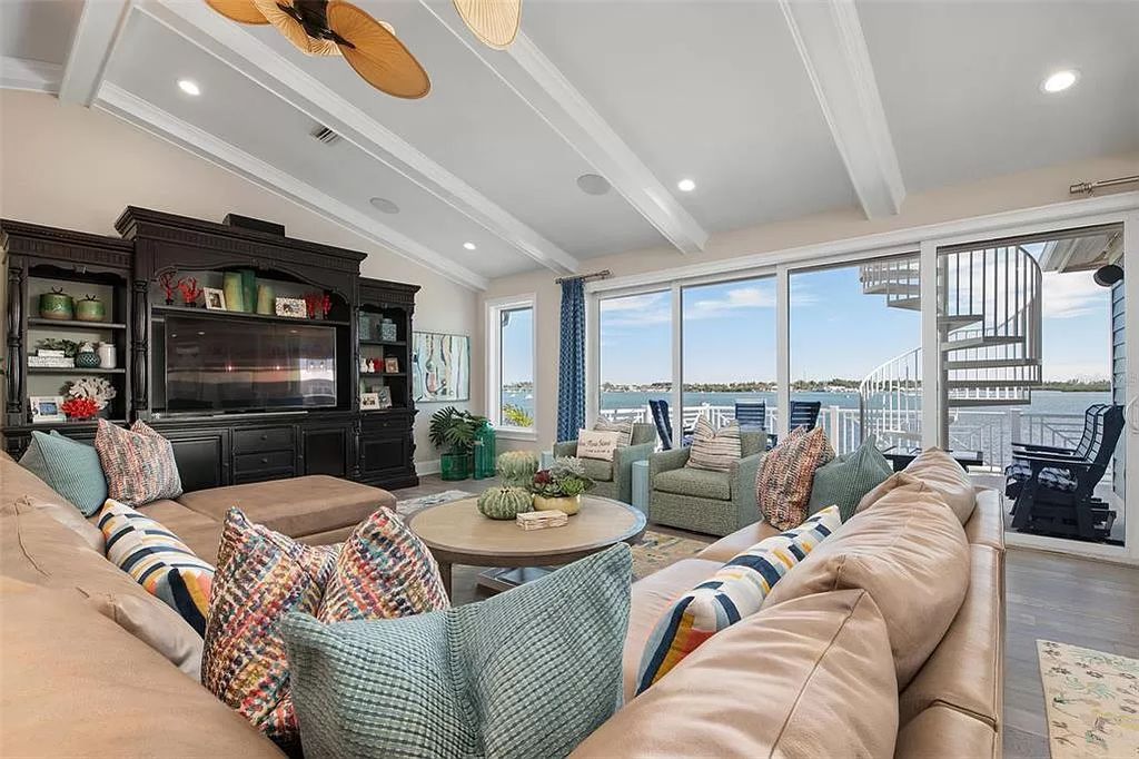 Discover luxury island living at its best in this exquisite seven-bedroom bayfront home in Mandalay Bay, Anna Maria Island.