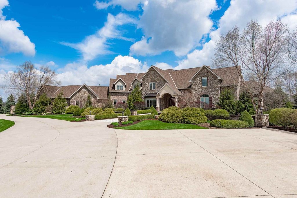 15718 Viberg Road Home in Leo, Indiana. Explore this elegant estate nestled on 11 manicured acres in Leo, IN. With over 11,000 square feet of living space, Venetian plaster walls, hand-scraped wood floors, and custom features throughout, this home offers the ultimate retreat.