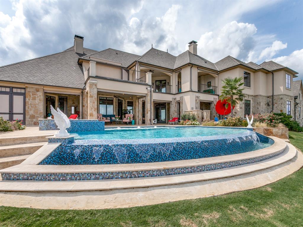 21395 Jamison Road Home in Chandler, Texas. Explore the epitome of luxury living in this custom-built "Bob Kurtz" Parade of Home, boasting panoramic waterfront views and a plethora of amenities. From the gourmet kitchen to the state-of-the-art media room, heated infinity-edge pool, and helipad for quick medical transport, this property offers unparalleled opulence and functionality.